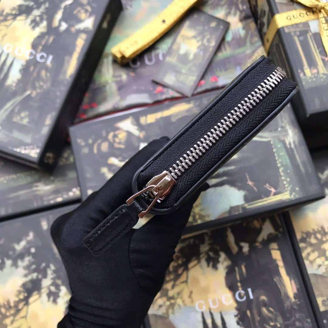 G*u*i leather zip around wallet with web