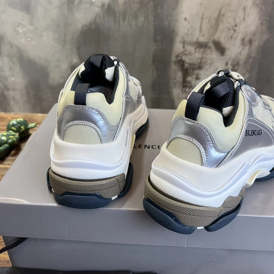 Ba*len*cia*ga women's triple s sneaker in black/white/silver - bb256