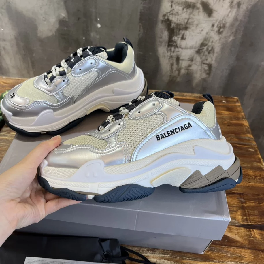 Ba*len*cia*ga women's triple s sneaker in black/white/silver - bb256