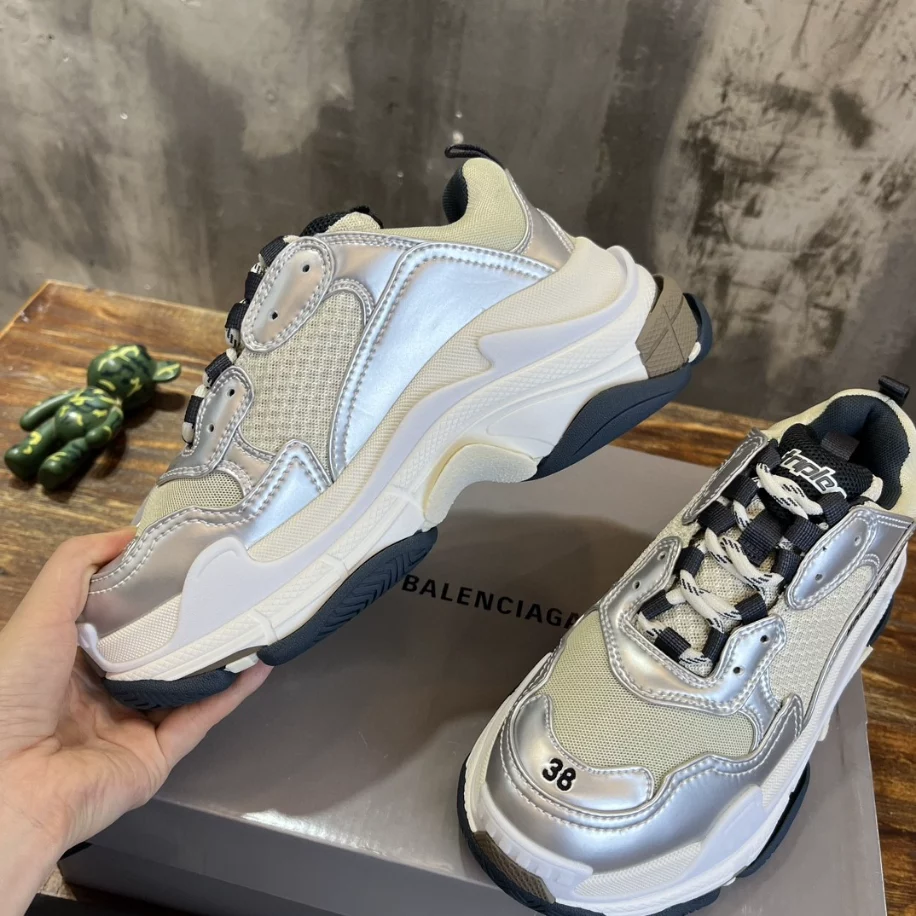 Ba*len*cia*ga women's triple s sneaker in black/white/silver - bb256